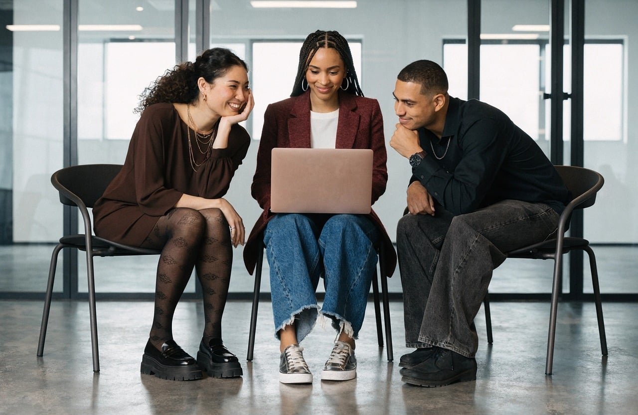 Marketing work reviewed around one laptop